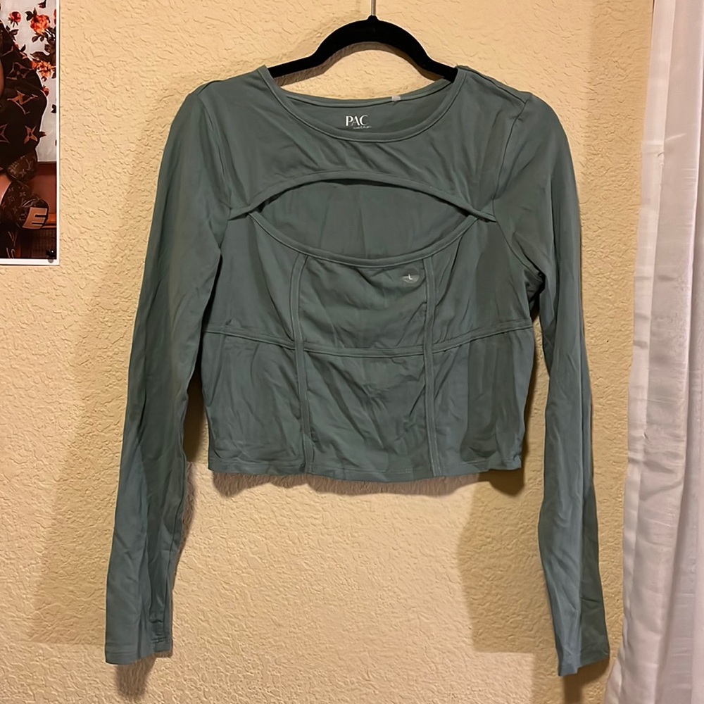 Long sleeve top. Hole in chest area